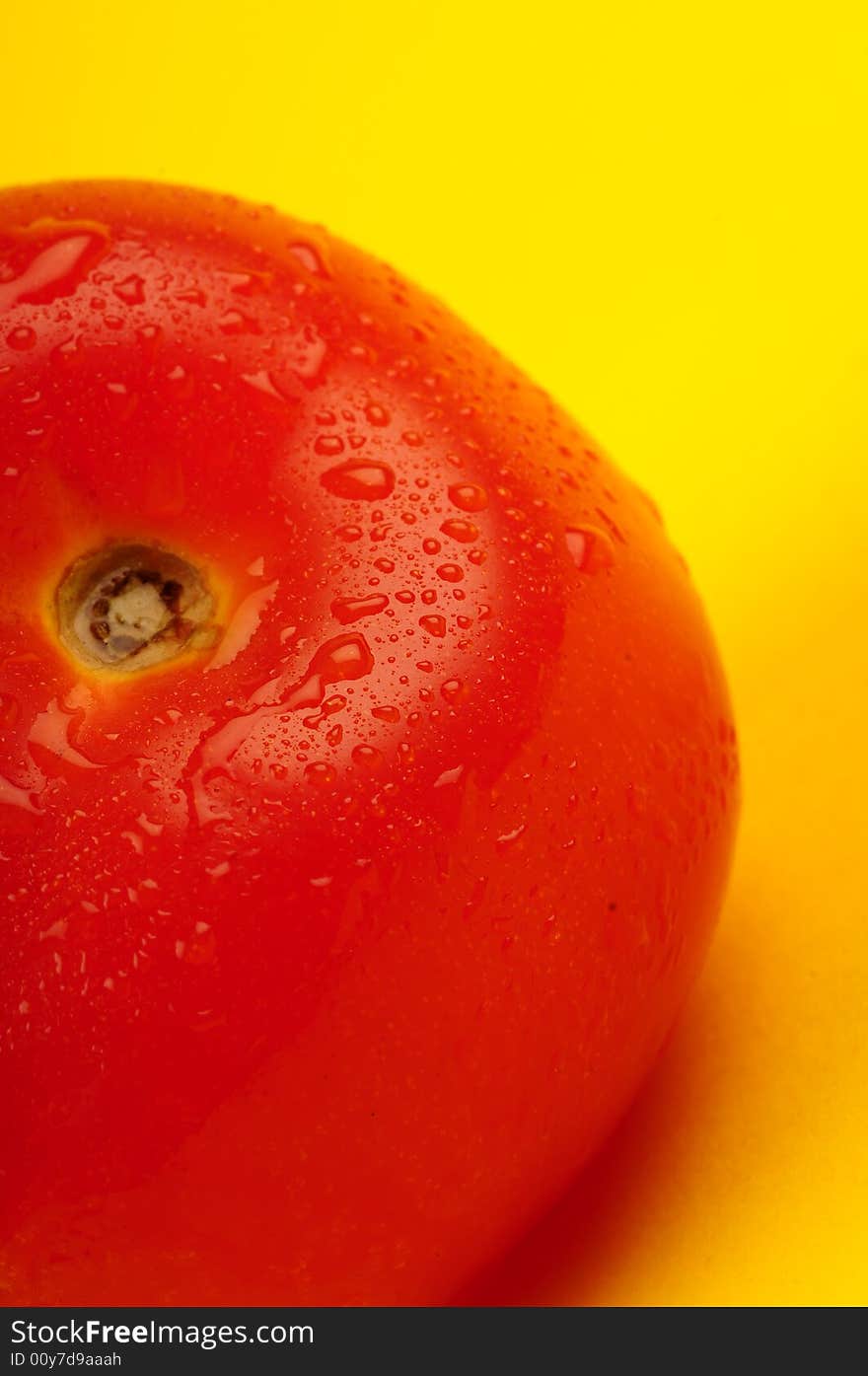 Tomato isolated on yellow background