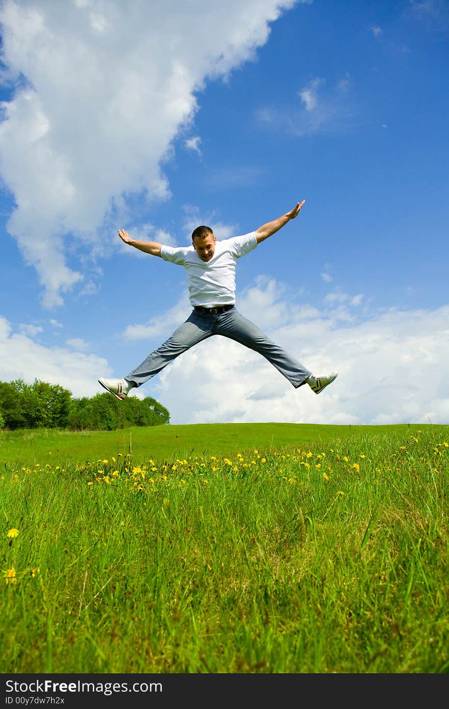 The man jumping on a lawn