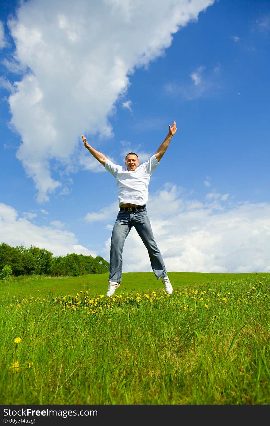 The man jumping on a lawn