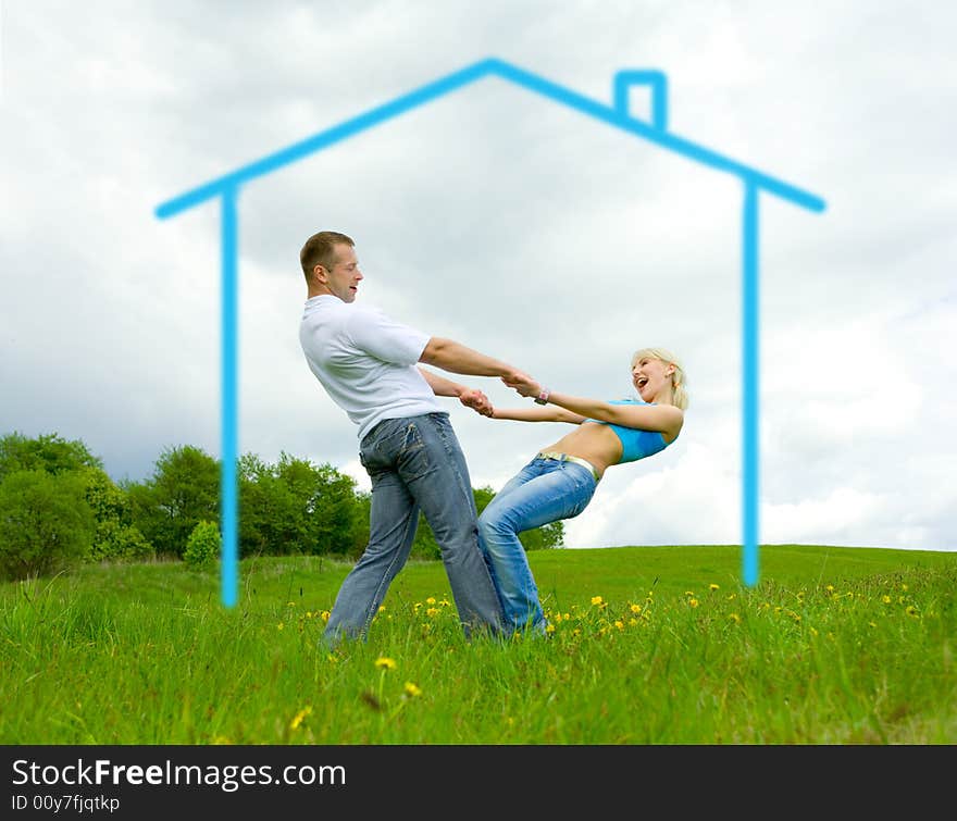 Young family jumping on a lawn