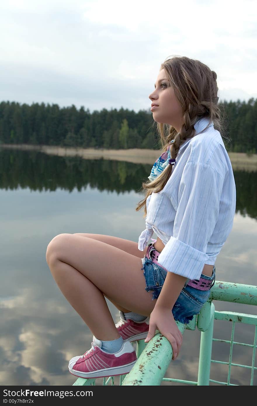 Portrait of young sexual girl on lake background