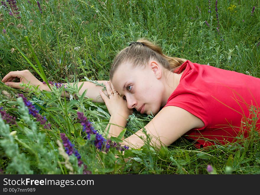 Pretty girl rest on meadow