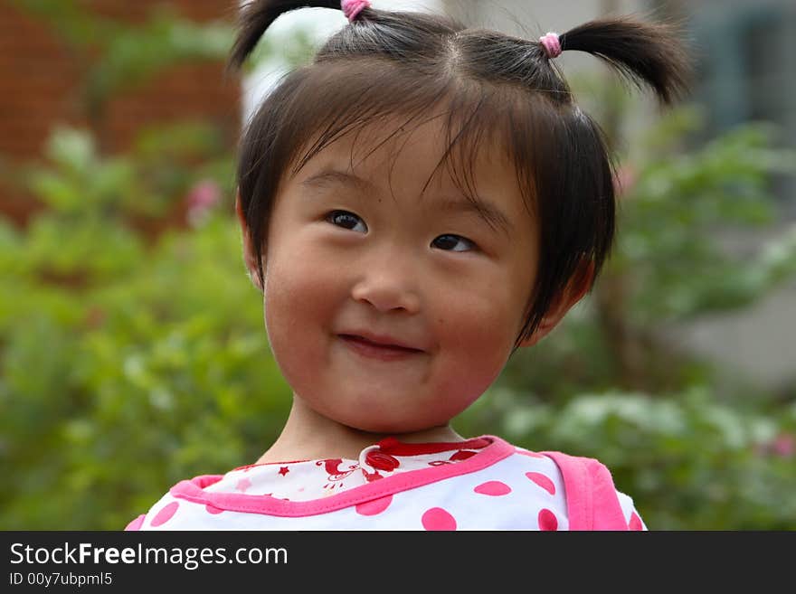 Cute little Chinese girl in summer