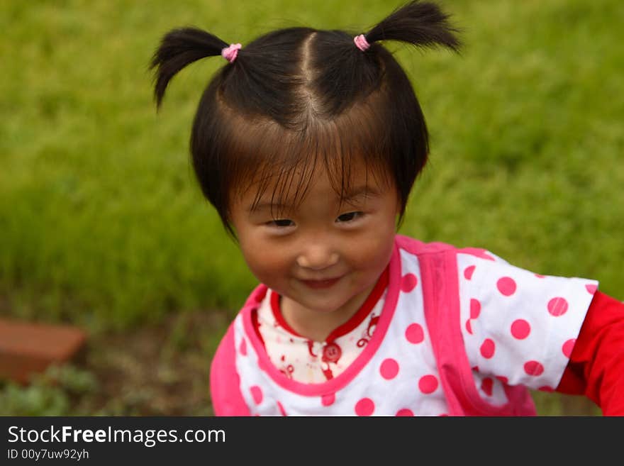 Cute little Chinese girl in summer