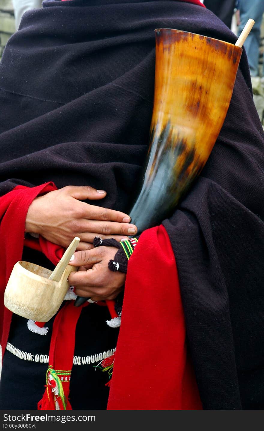 Tribal Man Holding A Bull Horn.