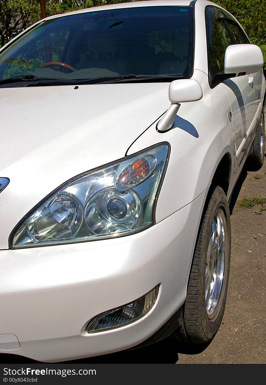 The Passenger car of the colour white.