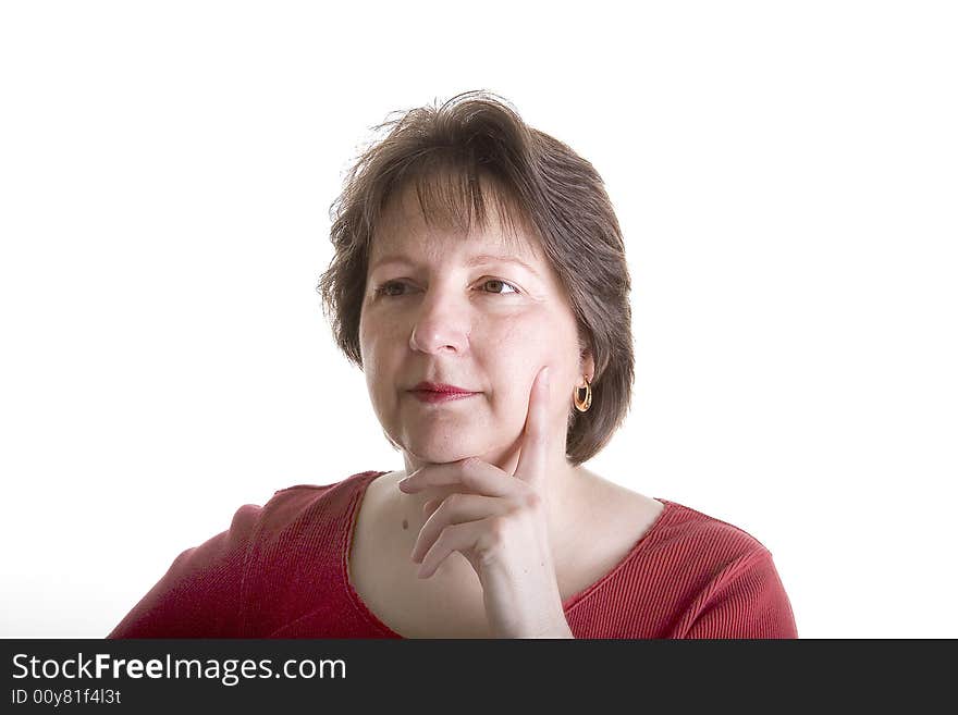 A nice looking woman in red on a white background with her hand on her cheek. A nice looking woman in red on a white background with her hand on her cheek