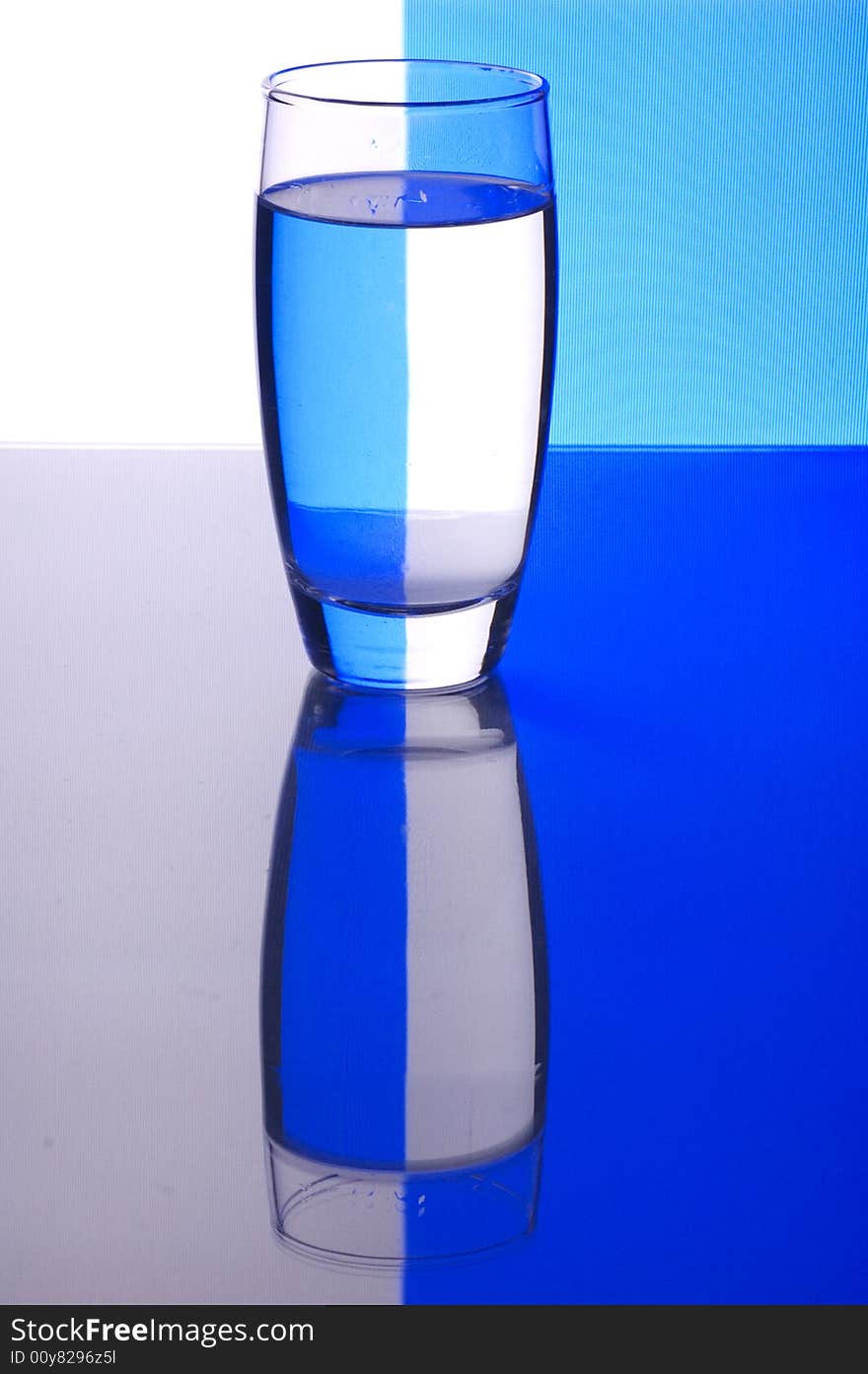 Glass with water with background