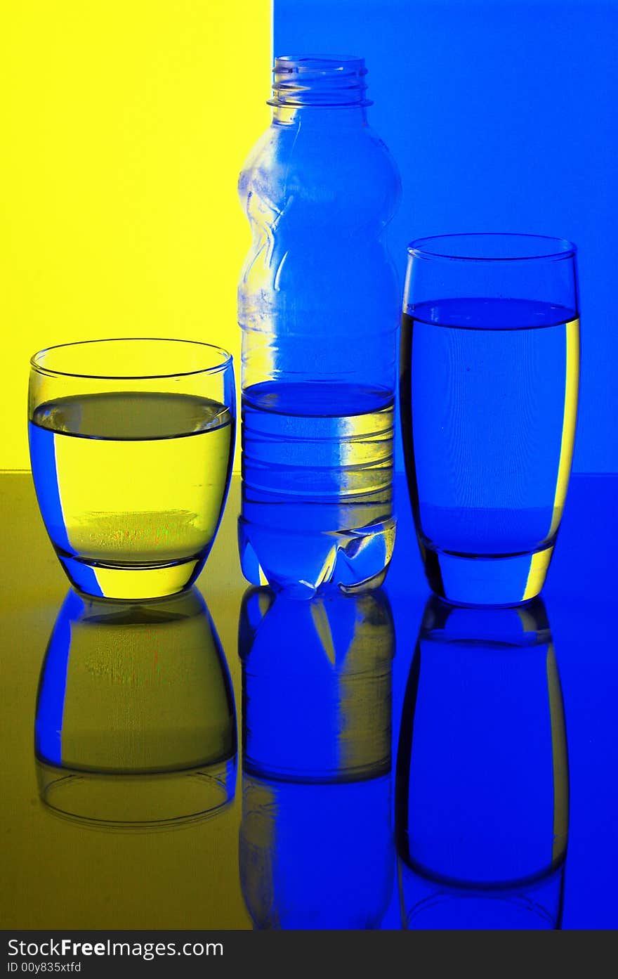 Glasses and bottle with water with background