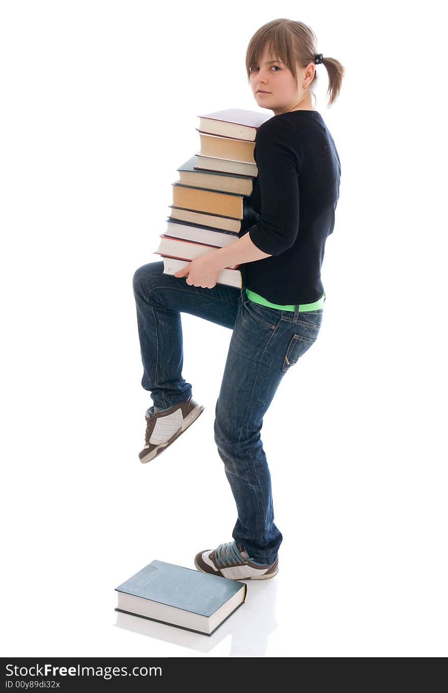 The young student with the book isolated on a white background. The young student with the book isolated on a white background