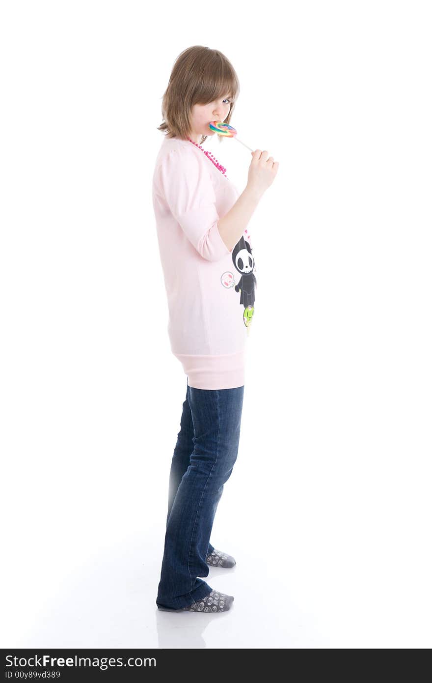 The girl with a sugar candy isolated on a white background