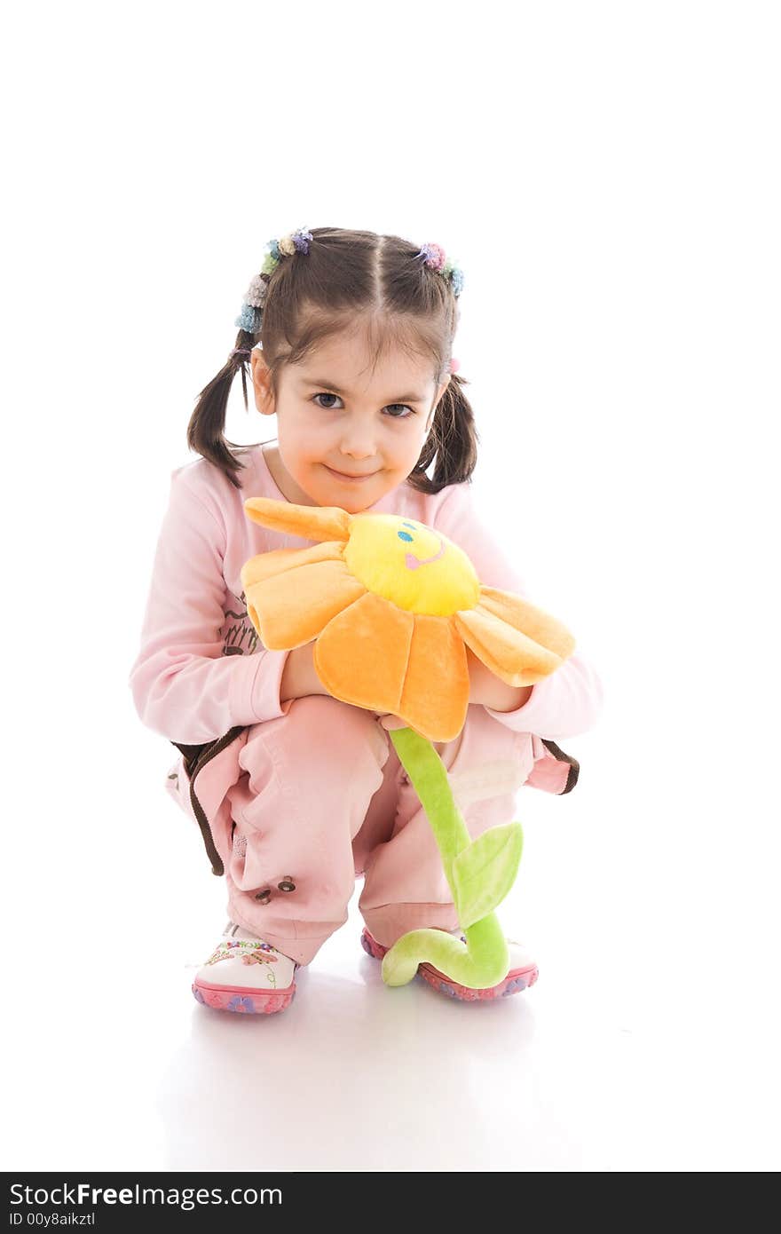 The young girl with flower isolated on a white