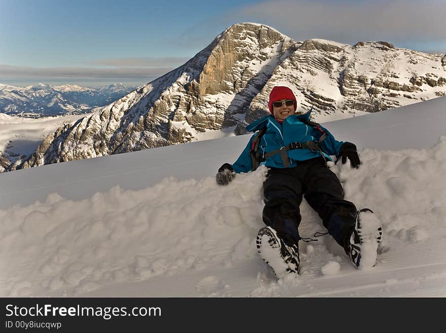 It is a path leading to Dachstein, Austria. My girlfriend is just enjoying the deep snow. It is a path leading to Dachstein, Austria. My girlfriend is just enjoying the deep snow.