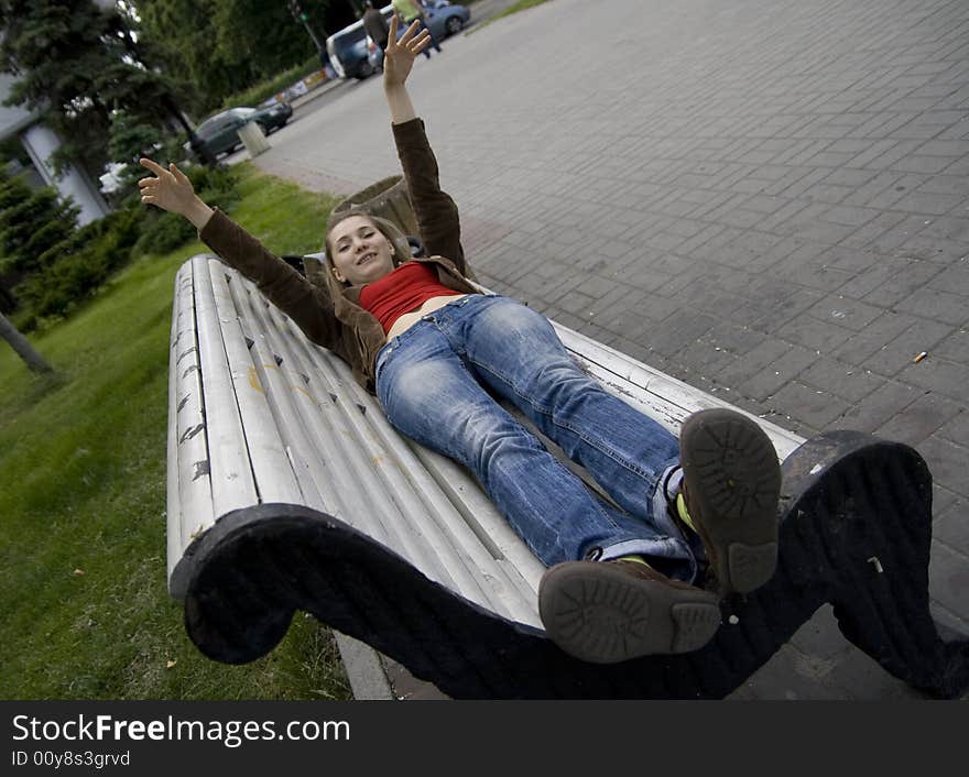 Girl lying on the bench