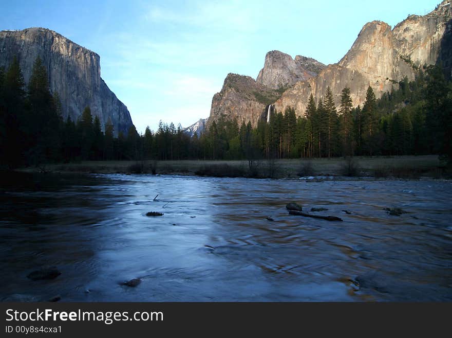 El Capitano and Bridevail fall with Riverbed at early dawn hours in Yosemite national park. California. USA