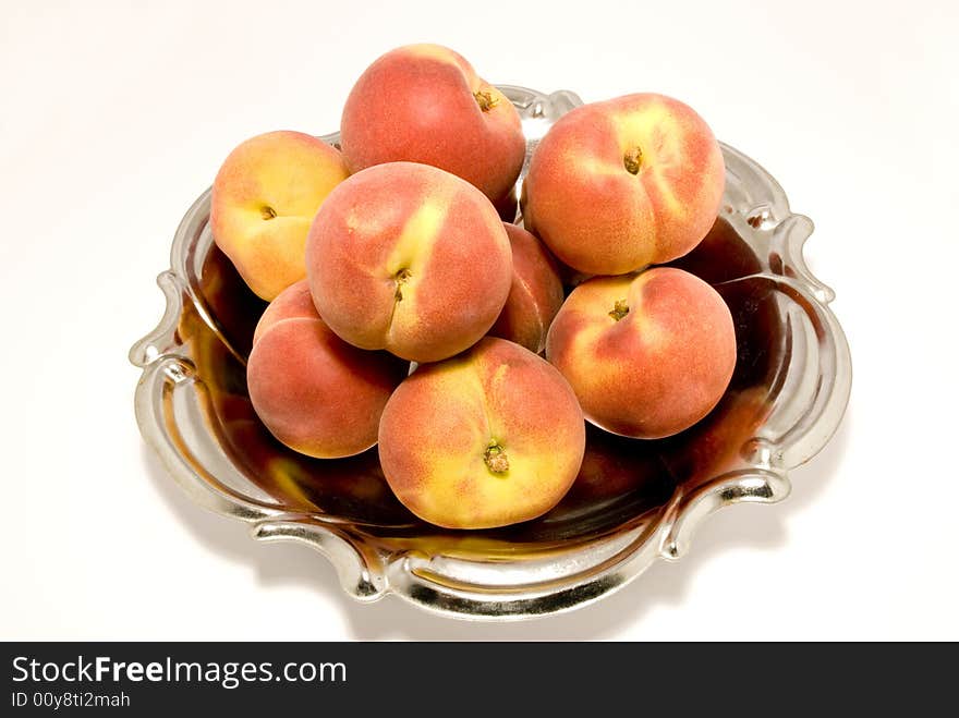 Peaches' still-life, arranged over white background