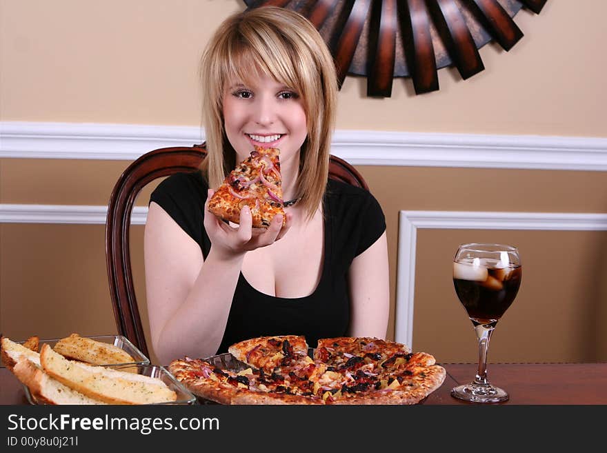 Girl eating pizza slice