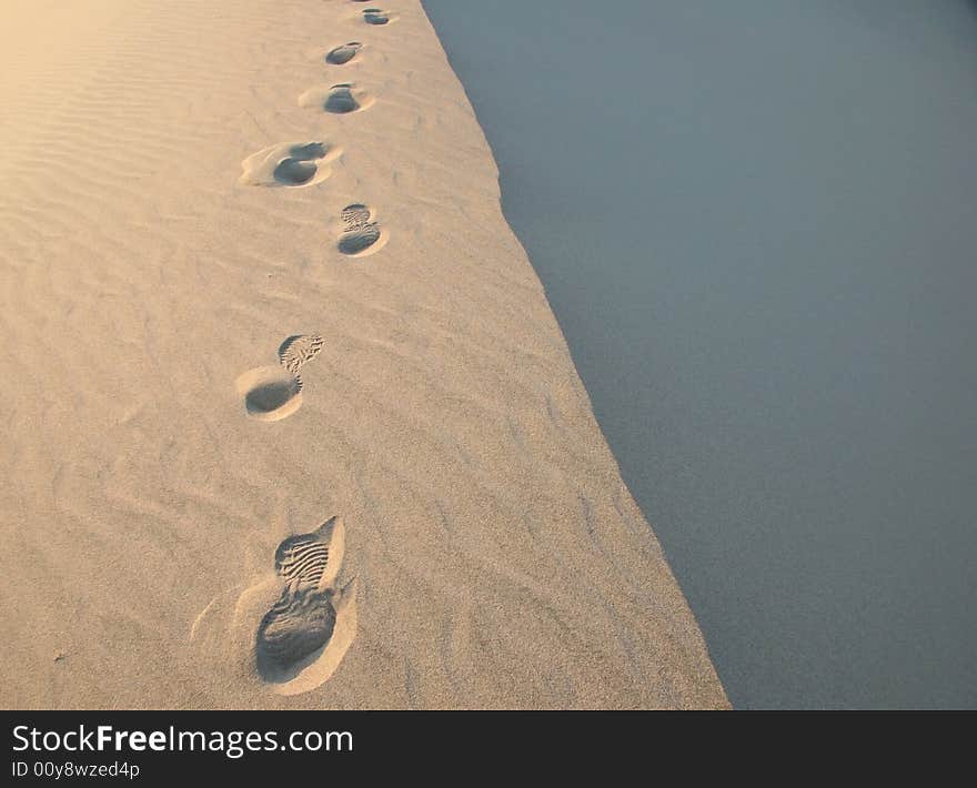 Footsteps in endless sand ripples in Death Valley. Death Valley national park. California. USA. Footsteps in endless sand ripples in Death Valley. Death Valley national park. California. USA