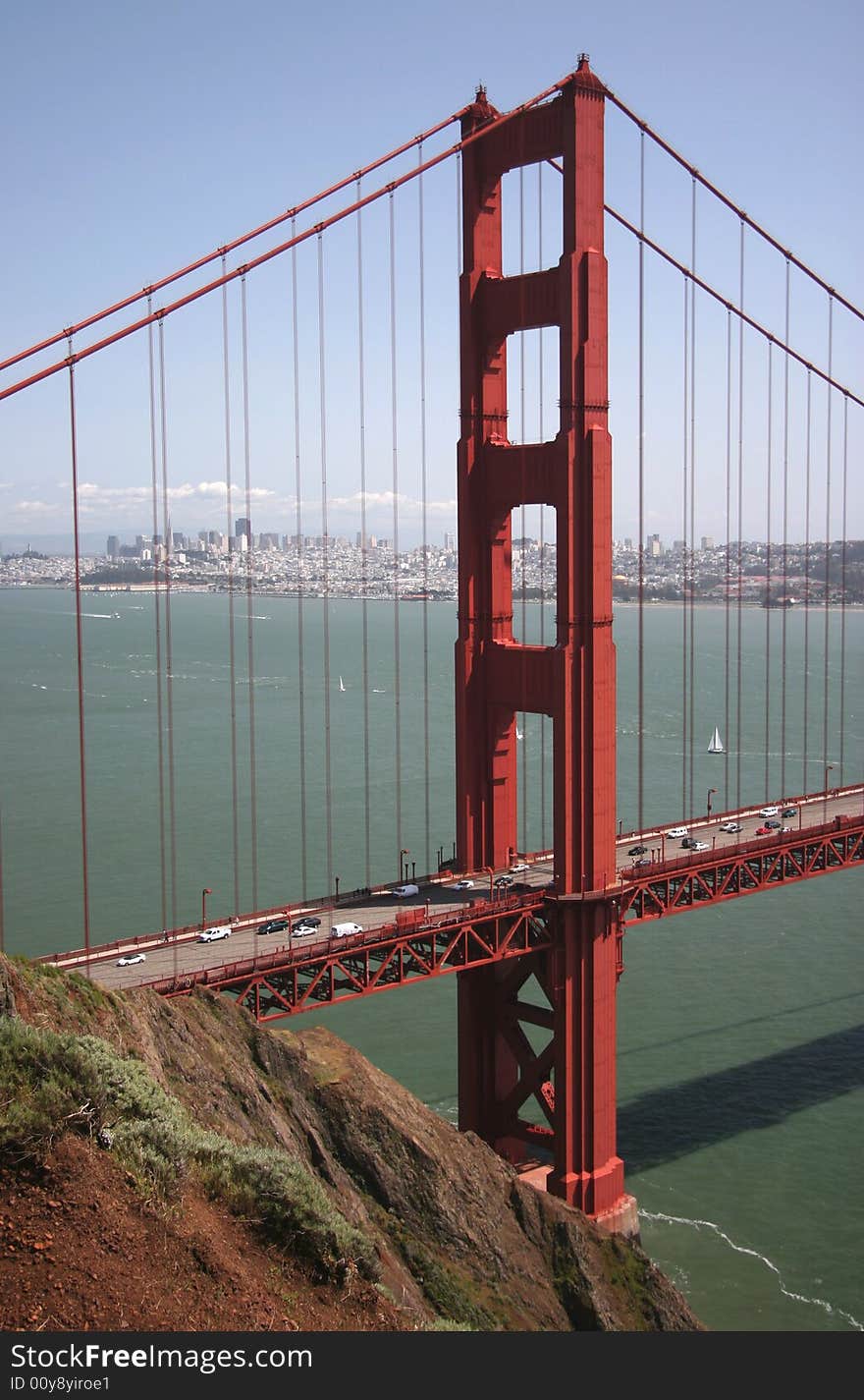 A traffic flows along the glowing Golden Gate Bridge. San Francisco, California, USA. A traffic flows along the glowing Golden Gate Bridge. San Francisco, California, USA