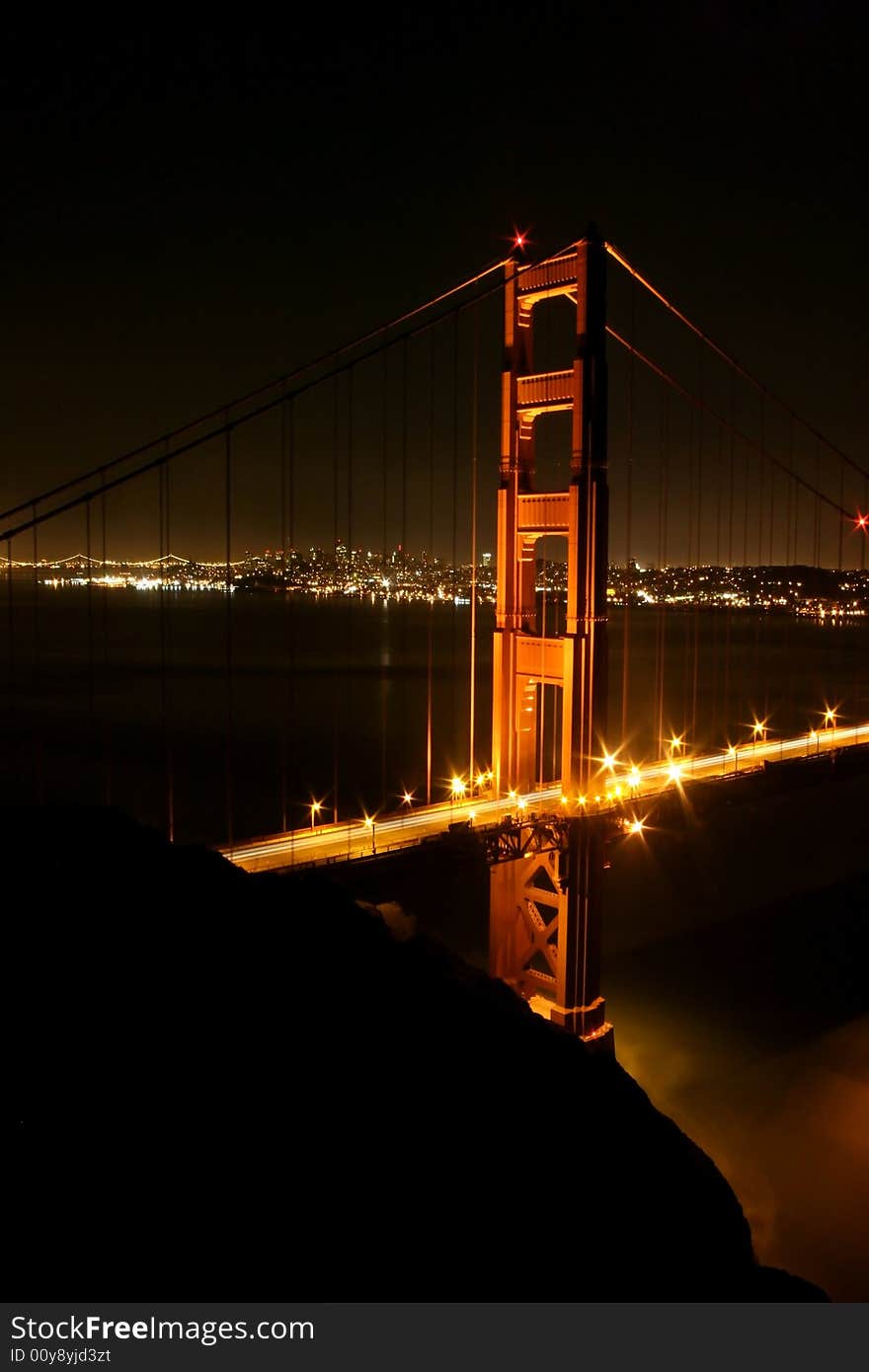 Golden Gate Bridge glows in lights. San Francisco, California, USA. Golden Gate Bridge glows in lights. San Francisco, California, USA