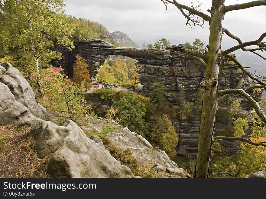 This is called Pravcicka gate, the biggest and most famous arch in the Czech republic, in the middle of colourful autumn scenery. This is called Pravcicka gate, the biggest and most famous arch in the Czech republic, in the middle of colourful autumn scenery