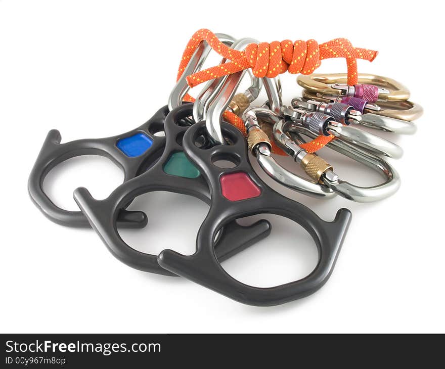 Photo of locking carabiners ,rope and rescue eight on white background. Photo of locking carabiners ,rope and rescue eight on white background.