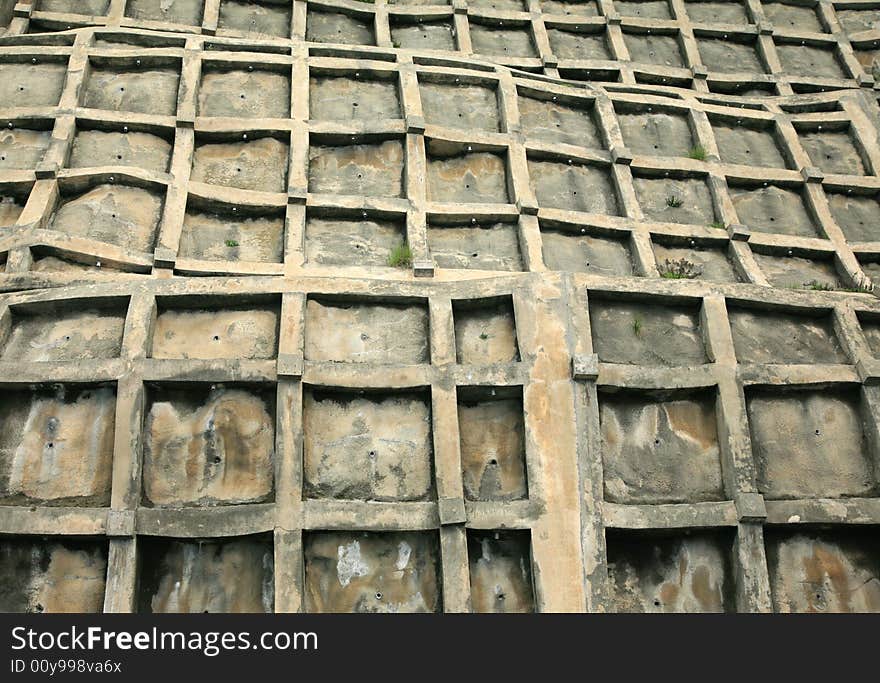 Distorted concrete retaining wall in Japan. Distorted concrete retaining wall in Japan