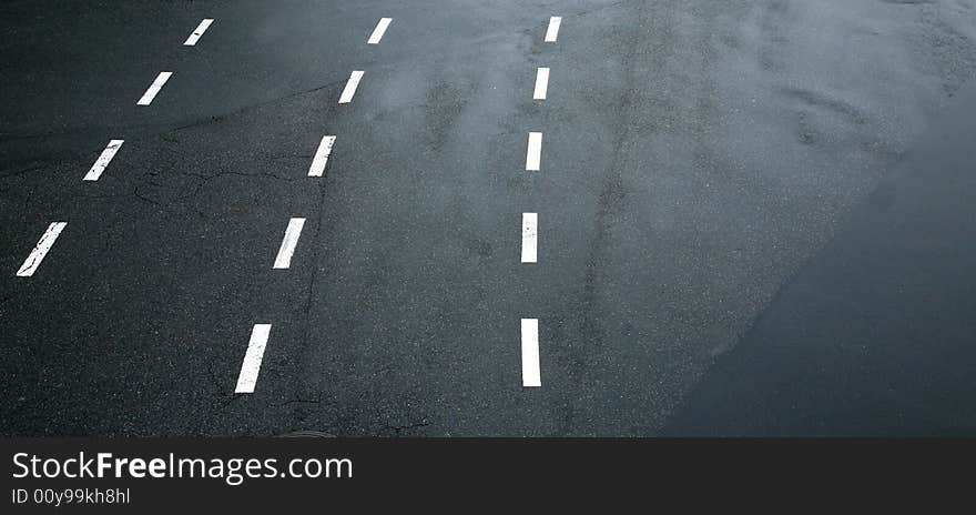 Traffic lines on asphalt as an abstract design