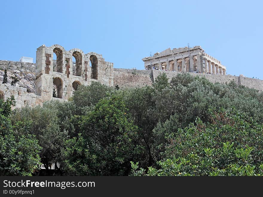 A view of the Acropolis of Athens (Greece) and a part of the facade of the ancient theater of Herod Atticus. A view of the Acropolis of Athens (Greece) and a part of the facade of the ancient theater of Herod Atticus