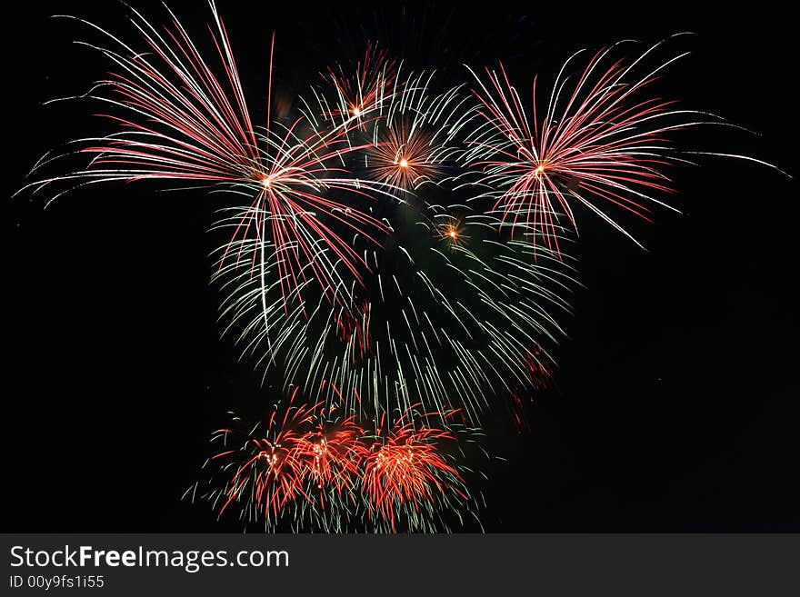 Colorful teddybear shaped fireworks against the dark sky. Colorful teddybear shaped fireworks against the dark sky