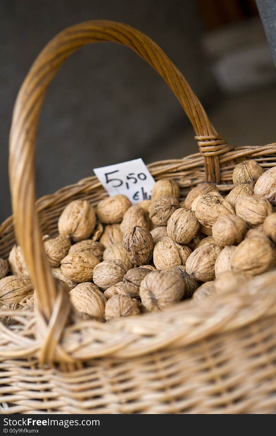 A basket of walnuts for sale