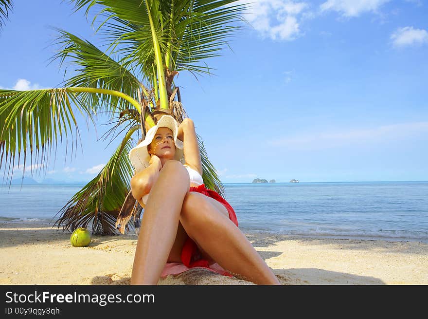 View of nice woman having fun on tropical beach. View of nice woman having fun on tropical beach