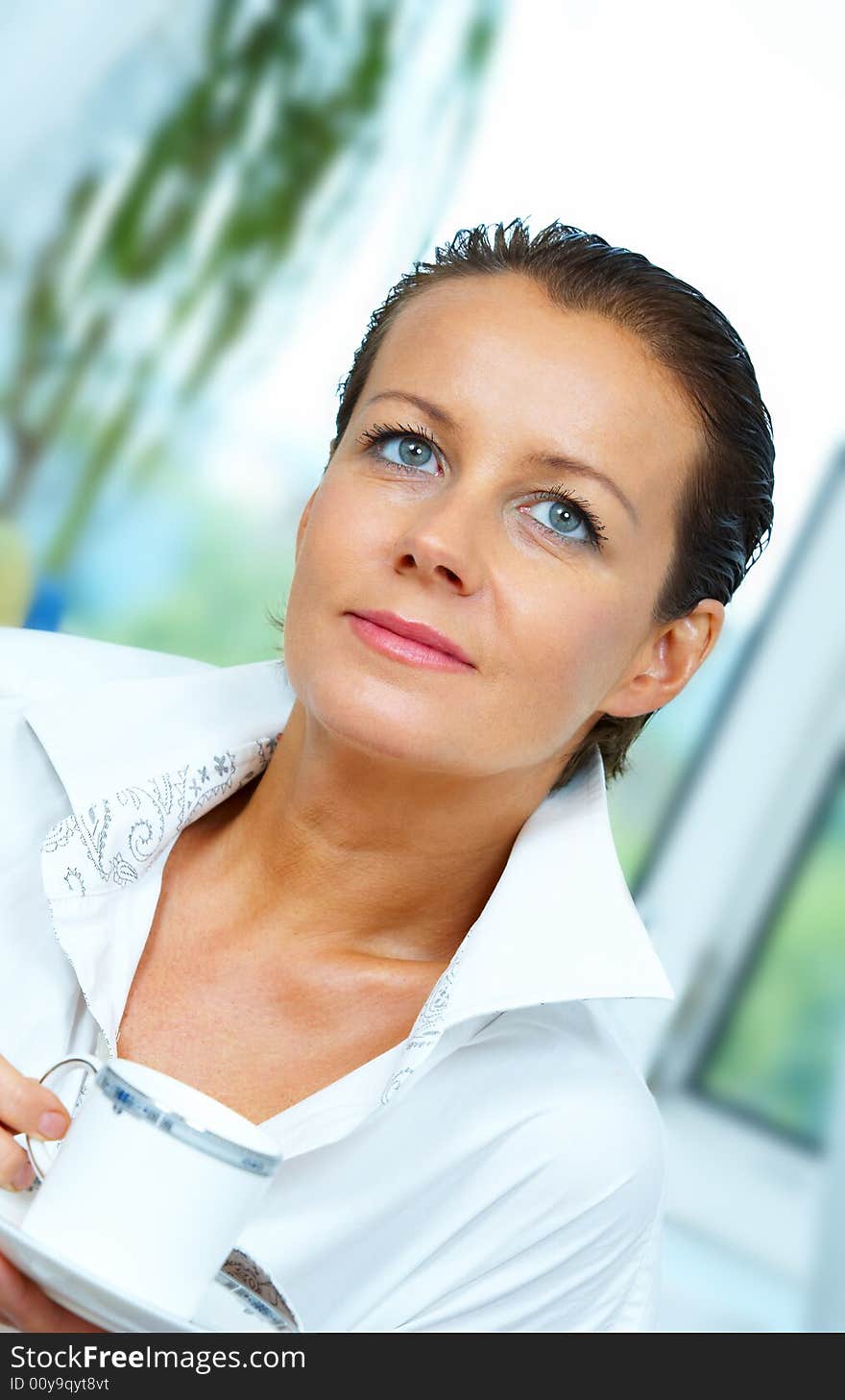 High key portrait of nice gorgeous woman drinking coffee. High key portrait of nice gorgeous woman drinking coffee