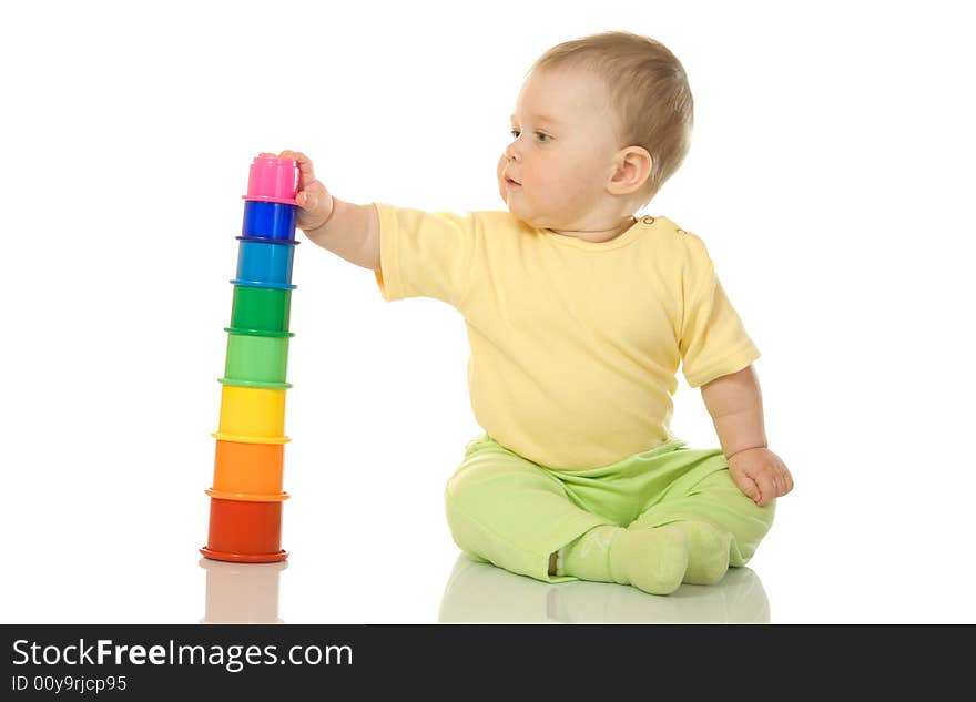 Small baby with toy pyramid isolated on white