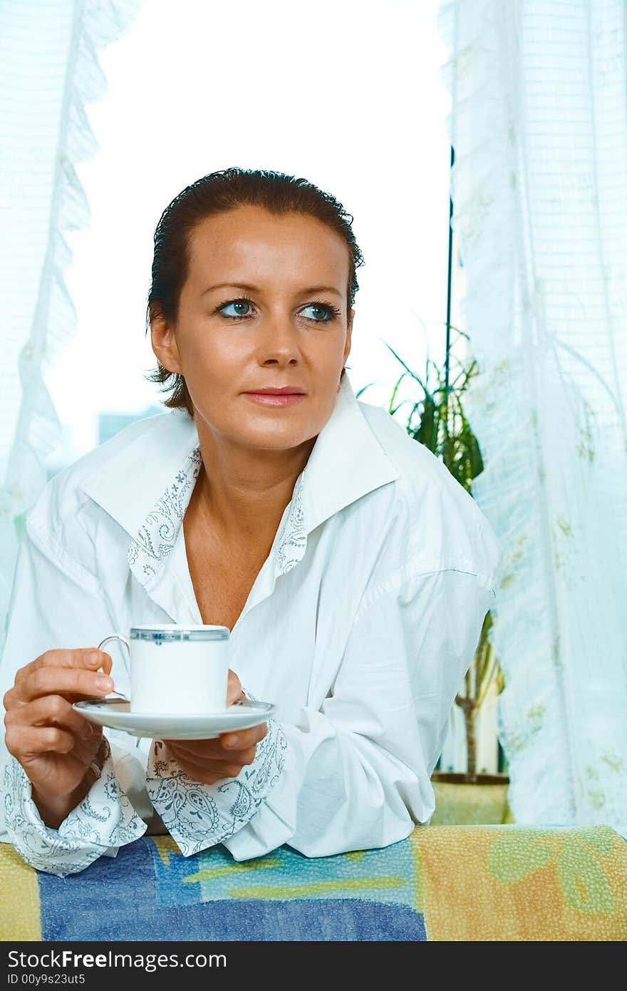 High key portrait of nice gorgeous woman drinking coffee. High key portrait of nice gorgeous woman drinking coffee