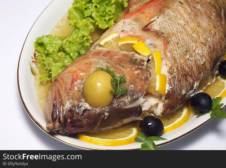 Baked perch fish with salad isolated. Baked perch fish with salad isolated