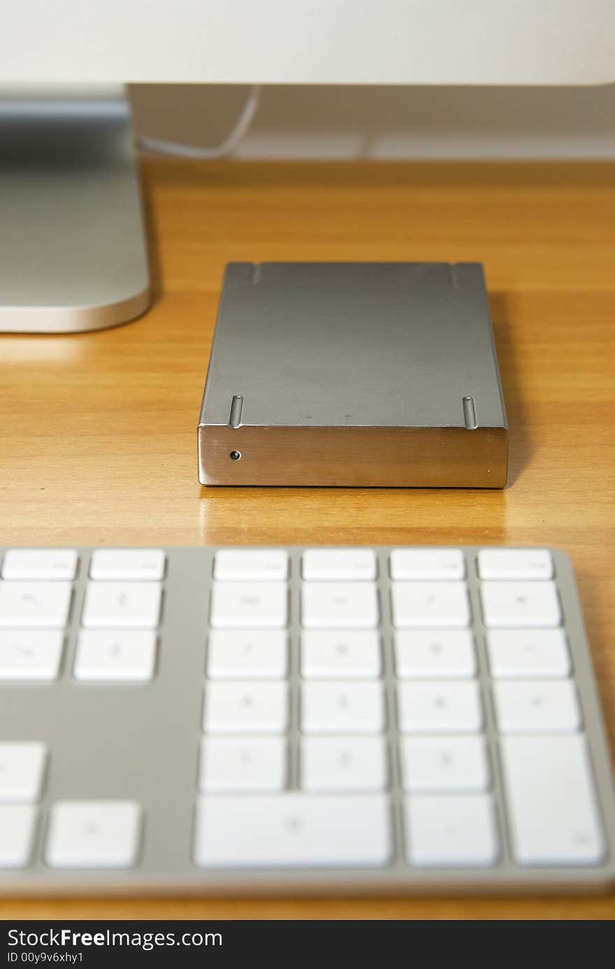 An Hard Drive and an alluminium keyboard. An Hard Drive and an alluminium keyboard