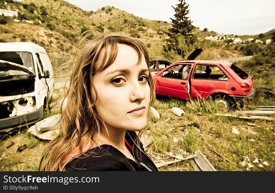 Young woman in the scrapyard