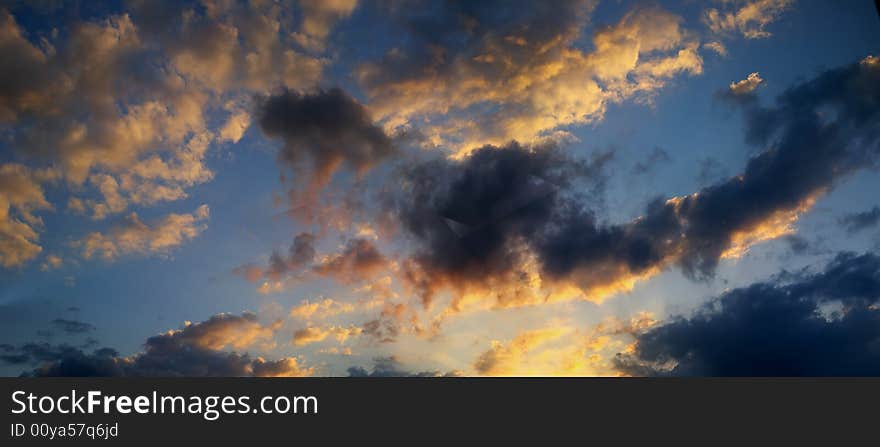 Clouds in the atmosphere. The sun is setting. Will it storm?. Clouds in the atmosphere. The sun is setting. Will it storm?