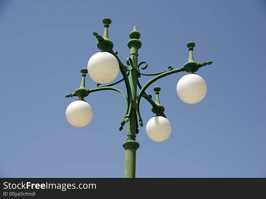 A street lamp over blue sky. A street lamp over blue sky