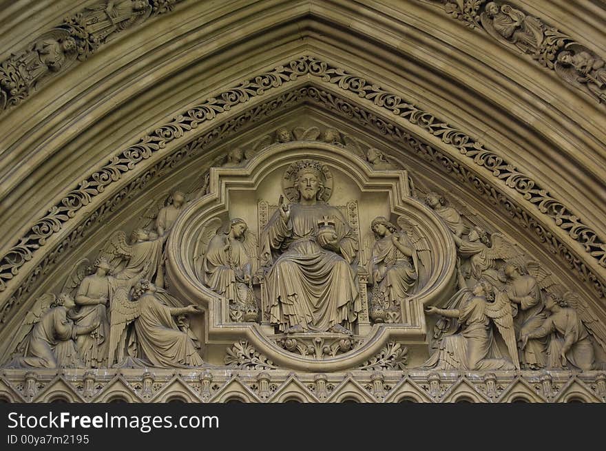 Detail showing God  in the entrance of Wetminster Abbey. Detail showing God  in the entrance of Wetminster Abbey