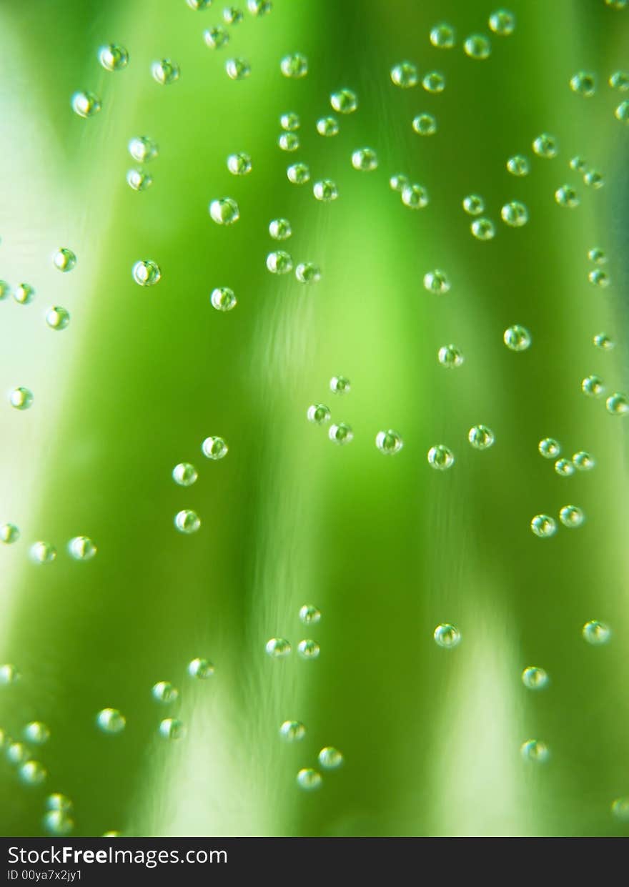 Water bubbles on green stalks background. Water bubbles on green stalks background