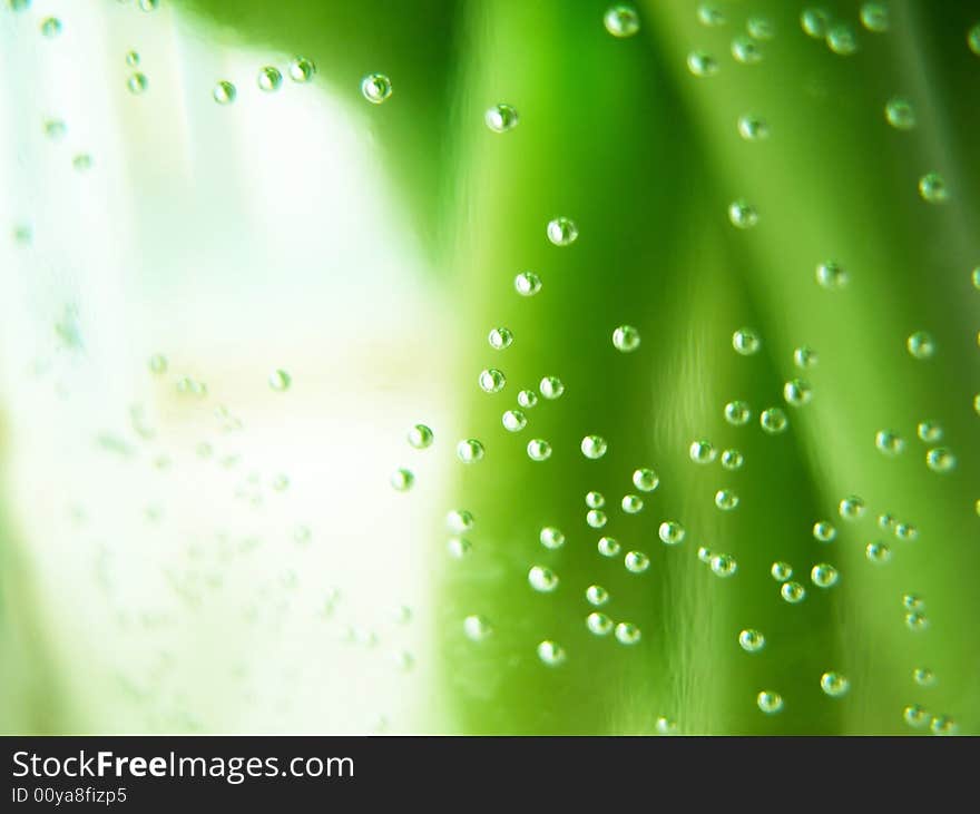 Water bubbles on green stalks background. Water bubbles on green stalks background