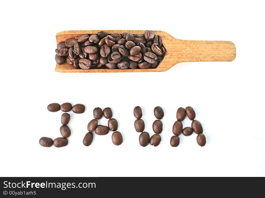 Studio image of scoop of coffee beans with the word 'Java' spelled out in coffee beans.