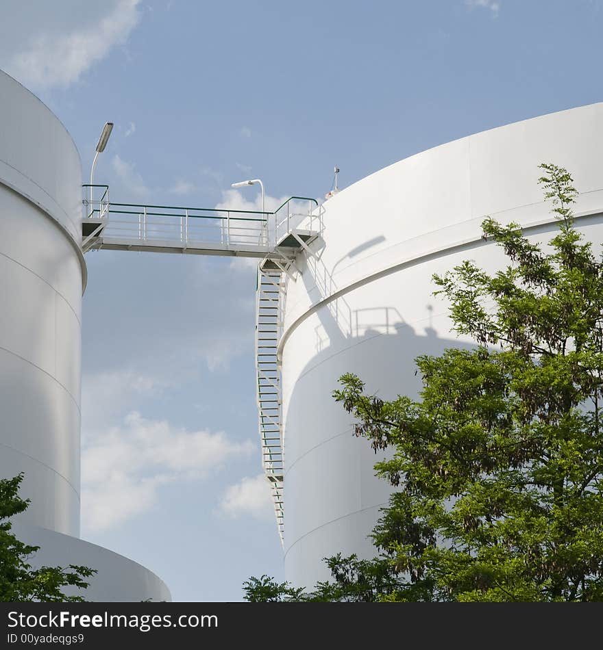 Crossing between two industrial gas tanks. Crossing between two industrial gas tanks