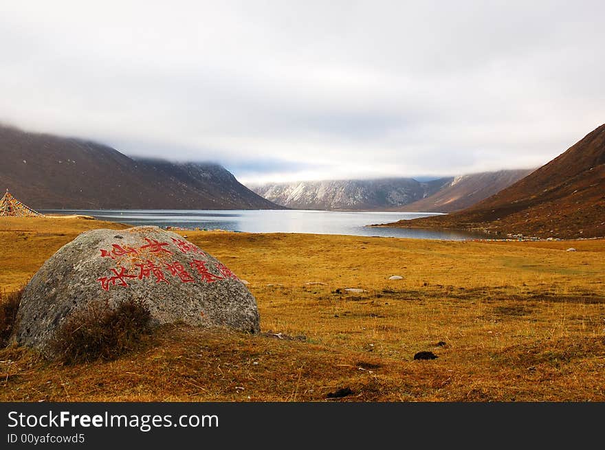 When travelling in Tibet of China in autumn,  meadows appear in front of us, and a lake on it is not far away from us. When travelling in Tibet of China in autumn,  meadows appear in front of us, and a lake on it is not far away from us.