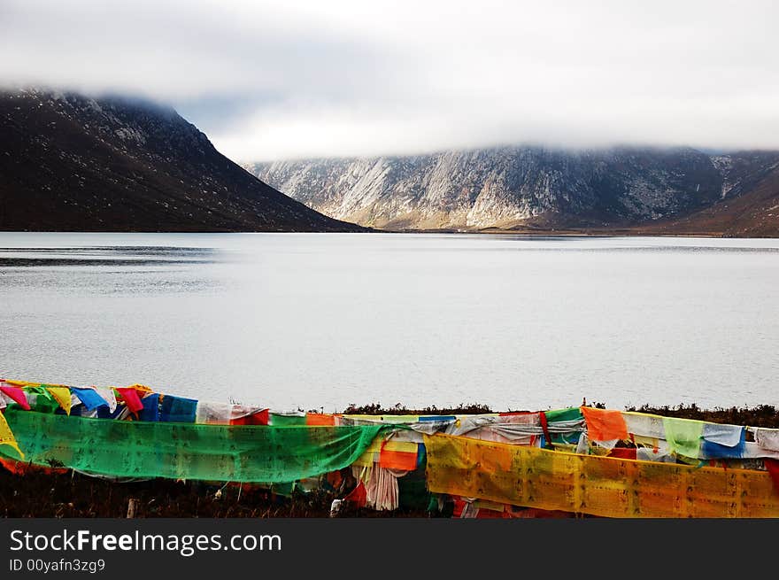 When travelling in Tibet of China, we saw a Tibet flag beside a lake.