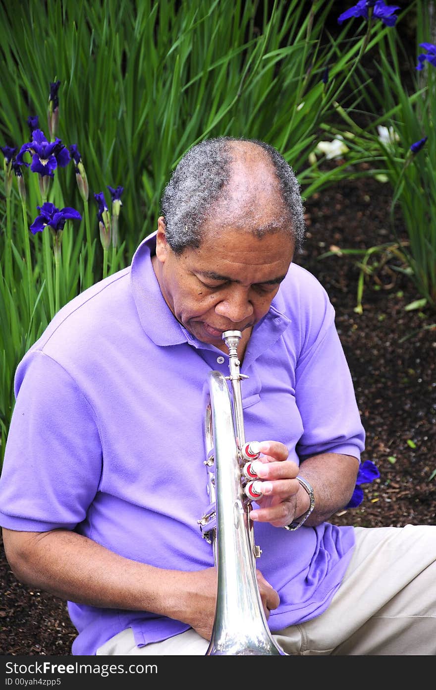 African american male with his musical instrument. African american male with his musical instrument.