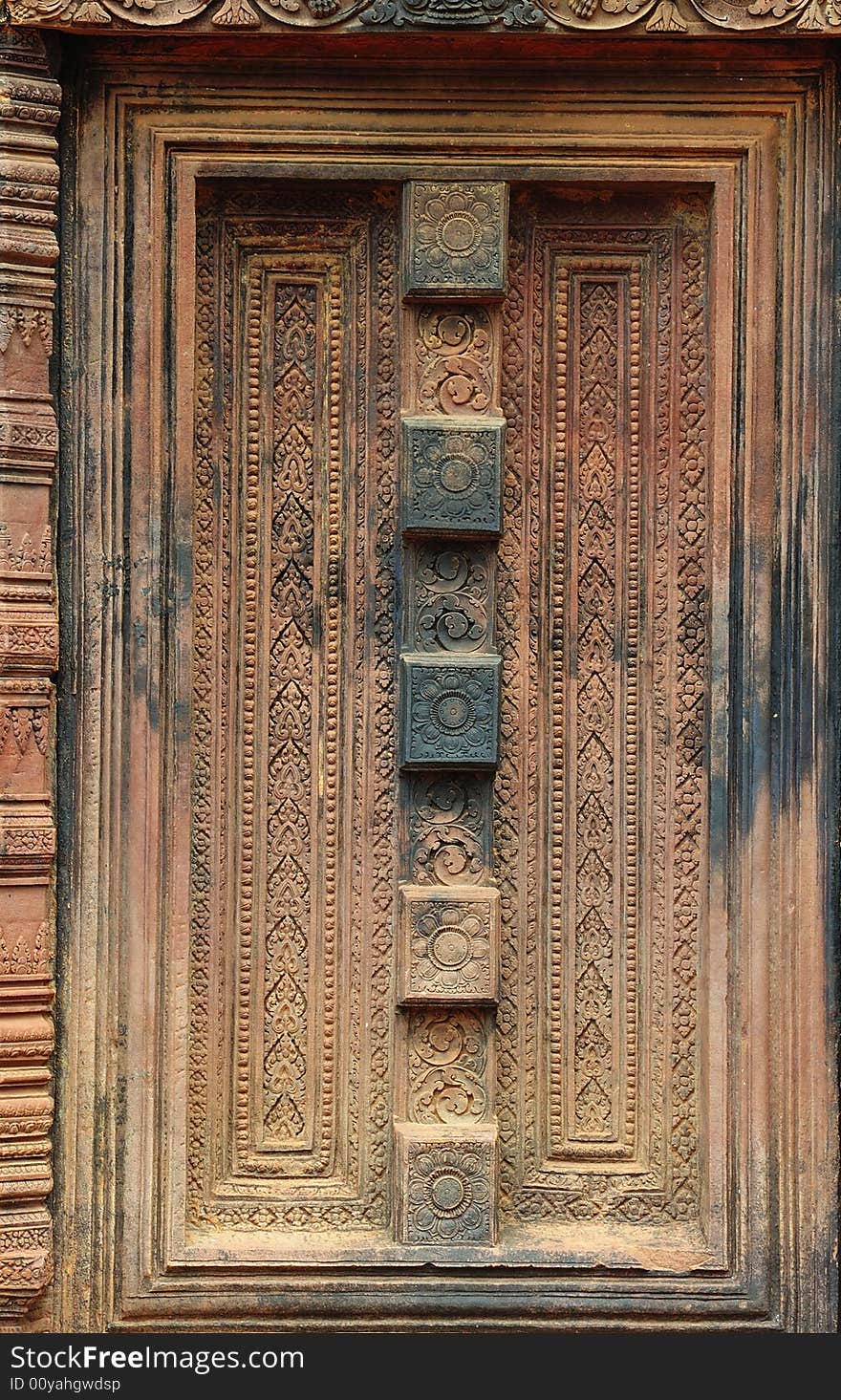 In Cambodia, in Angkor the 10th century temple of Banteay Srey was dedicated to the god Siva. The temple is known as �the jewel of the khmer art�. Here a false carved door. In Cambodia, in Angkor the 10th century temple of Banteay Srey was dedicated to the god Siva. The temple is known as �the jewel of the khmer art�. Here a false carved door