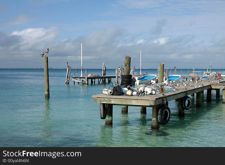 A woodem mole for anchoring fishing boats, Placencia, Belize. A woodem mole for anchoring fishing boats, Placencia, Belize